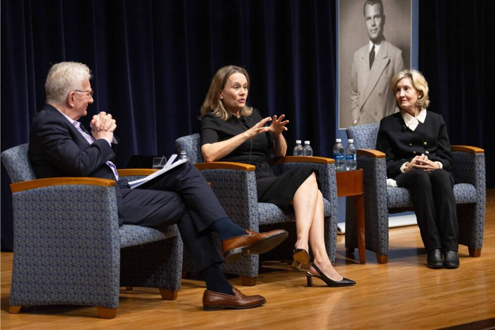 Speakers onstage during event